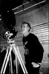 USA. New York. NYC. Andy Warhol at the Silver Factory with his first sophisticated anchored camera. 1964.